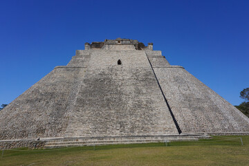 Fototapeta na wymiar Uxmal, Mexico: The Mayan Pyramid of the Magician, also known as The Pyramid of the Dwarf, 600-900 A.D.