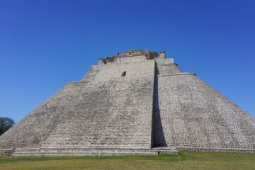 Fototapeta na wymiar Uxmal, Mexico: The Mayan Pyramid of the Magician, also known as The Pyramid of the Dwarf, 600-900 A.D.