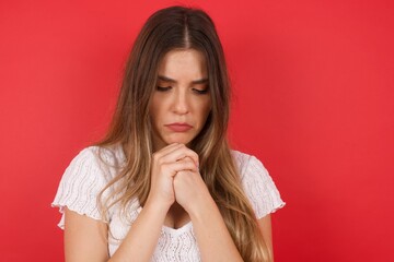 Sad pretty girl feeling upset while spending time at home alone. Beautiful young blonde female with...