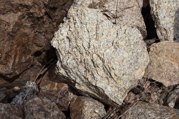 a fragment of gray-brown rock, close-up for background or texture.