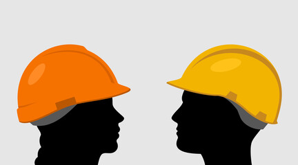 People in construction helmets