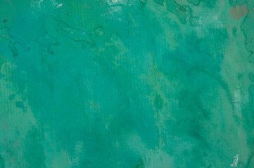 Green abstract painted cardboard sheet. Bright green background