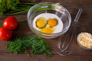 3 egg omelet with milk. Cook breakfast. Eggs with milk in a glass plate