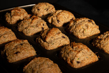 succulent muffin with chocolate flavor and zucchini in a pan