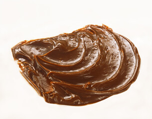 smeared walnut paste on a white background