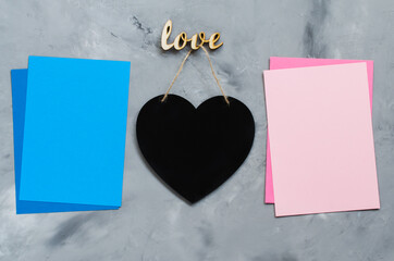 Newborn concept. Baby boy and baby girl. Twins baby background. Pink and blue empty papers with copy space.