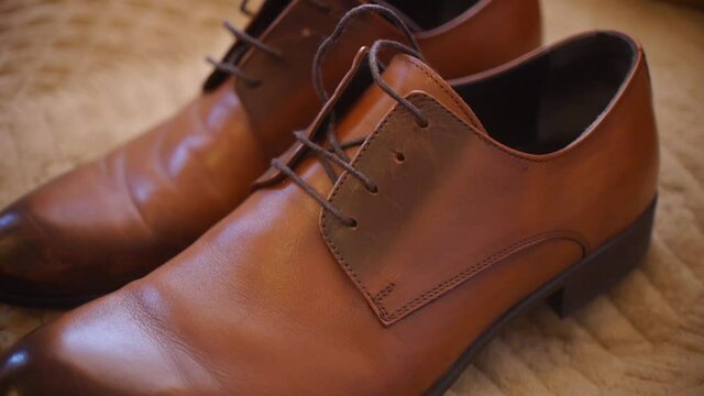 Groom's shoes, brown leather shoes, tilt shot
