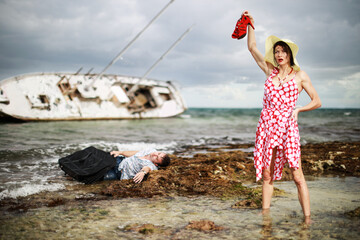 Man and woman escaped from their sunken yacht after storm. Concept with humor. 
