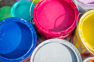 Cans of bright colorful pain