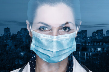 Face of a female doctor in a mask against the backdrop of the city at night.
