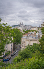 Fototapeta na wymiar Paris, France - 06 07 2020: View of the Montmartre district from the Bergeyre hill