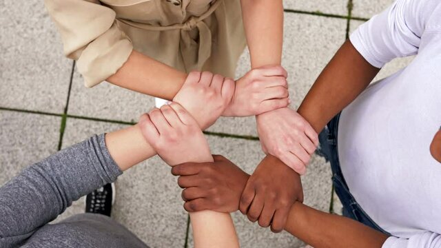 Symbolic plexus of hands with different skin colors.