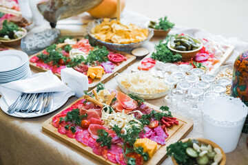 Delicious sweets on wedding candy buffet with desserts, cupcakes