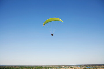 Fototapeta na wymiar Glider pilot flying on glider. Skydiving flying. Parachute extreme sport.