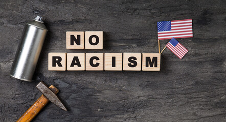 wooden cubes with no racism words