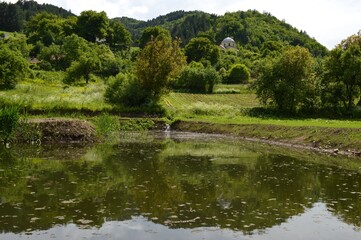 Fototapeta na wymiar a reflection of the old monastery in the lake