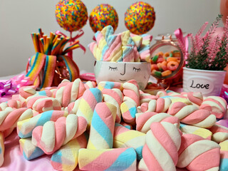 Delicious stuffed and colorful marshmellos, making a beautiful party table.