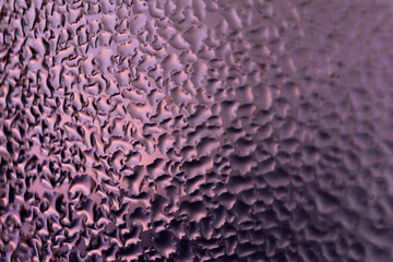 water droplets on glass lilac purple violet color  - blurred background picture with copy space for ad text