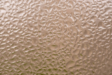 water droplets on glass light gold color - blurred background picture with copy space for ad text