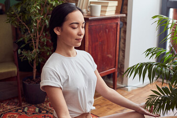 Young beautiful female relaxing while doing her morning exercises
