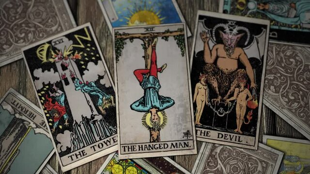 The Hanged Man in Tarot Cards Hanging Upside Down From the Living World Tree Devil With Horns The Tower Torture.
