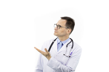 Fototapeta premium Serious senior age doctor in medical coat, glasses and stethoscope pointing to empty text space isolated on white background. Health, healthcare, insurance and medicine clinic ads concept