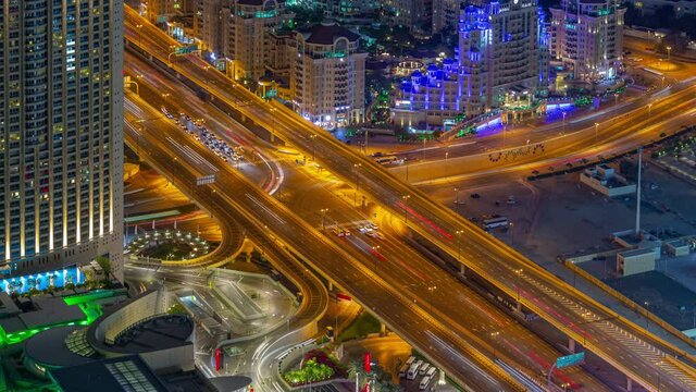 night illuminated dubai city center famous traffic street crossroad rooftop panorama timelapse 4k united arab emirates  