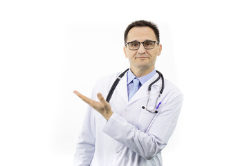 Fototapeta premium Positive handsome doctor in medical coat and stethoscope pointing at empty text space isolated on white background, looks at camera with smile. Health, healthcare, insurance and clinic ads concept