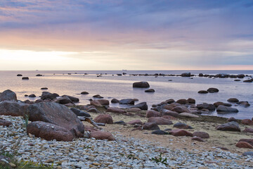 Stones piled in the sand on the seashore