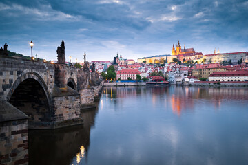 Charles bridge, Vltava river and Prague castle after sunset
