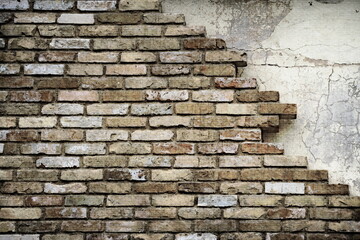 The destroyed brick wall of the building. Gloomy picture.