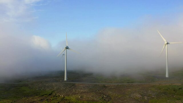 4k drone footage (Ultra High Definition) of wind turbines. Splendid summer scene of Faroe Islands, Kingdom of Denmark, Europe. Ecology concept background.