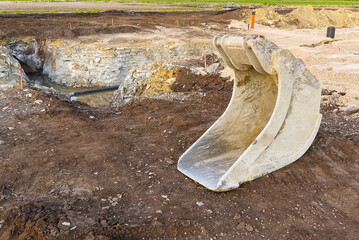 Excavator Bucket. Excavator bucket on ground, Industrial excavator machine.