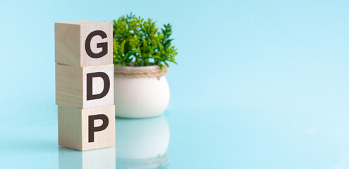 GDP - Gross Domestic Product - concept, cube wooden block with alphabet combine abbreviation GDP.