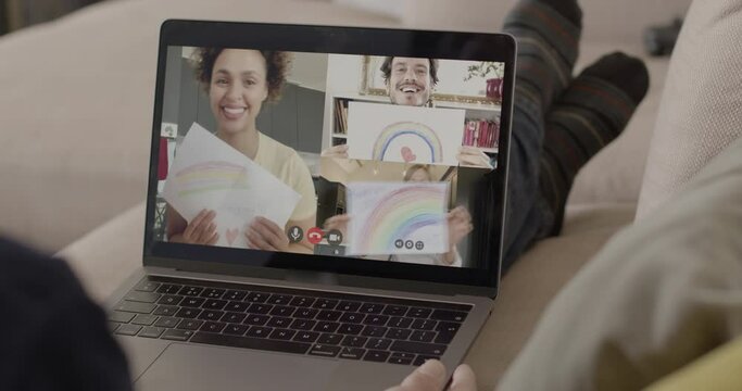Group on video call showing Rainbow drawing to thank essential workers during the Coronavirus Pandemic
