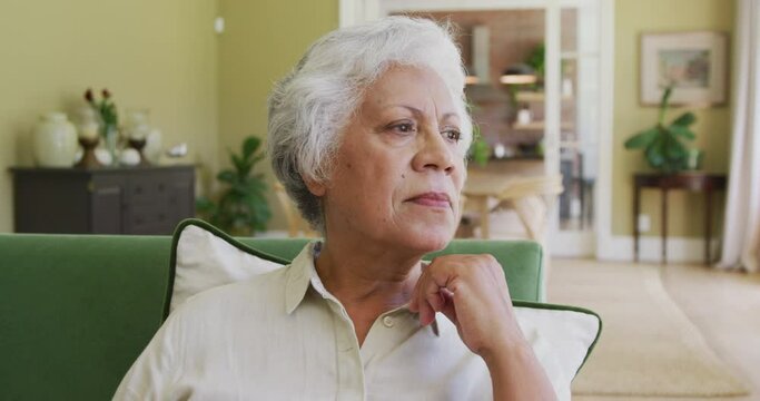 Senior mixed-race woman spending time and thinking ah tome