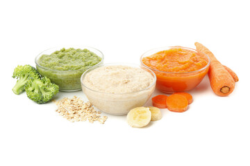 Bowls with healthy baby food isolated on white background