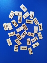 Composition of wooden numbers on a blue background