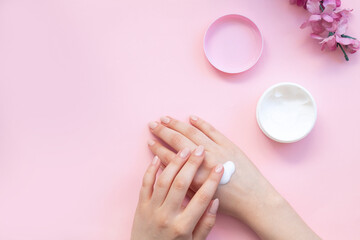 Moisturizing care skincare face cream for healing complicated troubled skin type in an open jar with visible texture. Copy space, close up, background, flat lay, top view. 