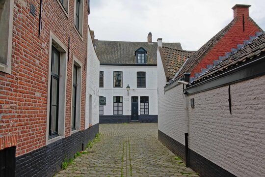 Streets with white painted brick houses of the Holy corner or Old Saint Elisabeth beguinage, Ghent.