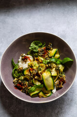 Vegetarian dish with courgette, pesto and pumpkin seeds
