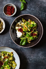 Vegetarian dish with courgette, pesto and pumpkin seeds