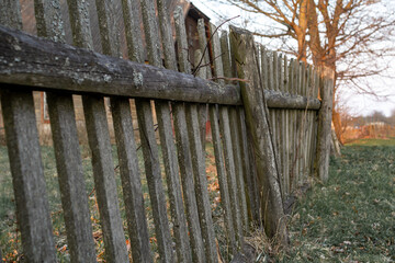 An old, twisted wooden fence in the village.