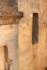The walls of an ancient church in the rays of the evening sun