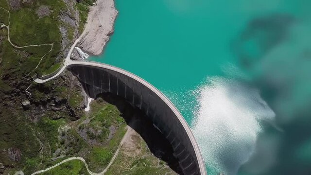 Flight over of Kaprun high mountain reservoir Mooserboden Stausee in the Hohe Tauern, Salzburger land, Austria.