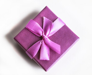 Top view of violet squared present box isolated against a white background.