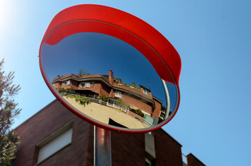 Convex spherical road mirror. Road mirror for road safety in the city