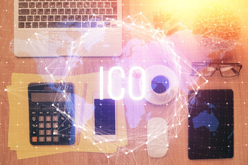 Double exposure of blockchain theme hologram over table with phone. Top view. Crypto technology concept.