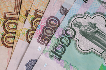Russian money. Banknotes of different denominations. One thousand, five hundred and two hundred rubles. Money close-up background.