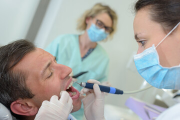 Obraz na płótnie Canvas female dentist and male patient